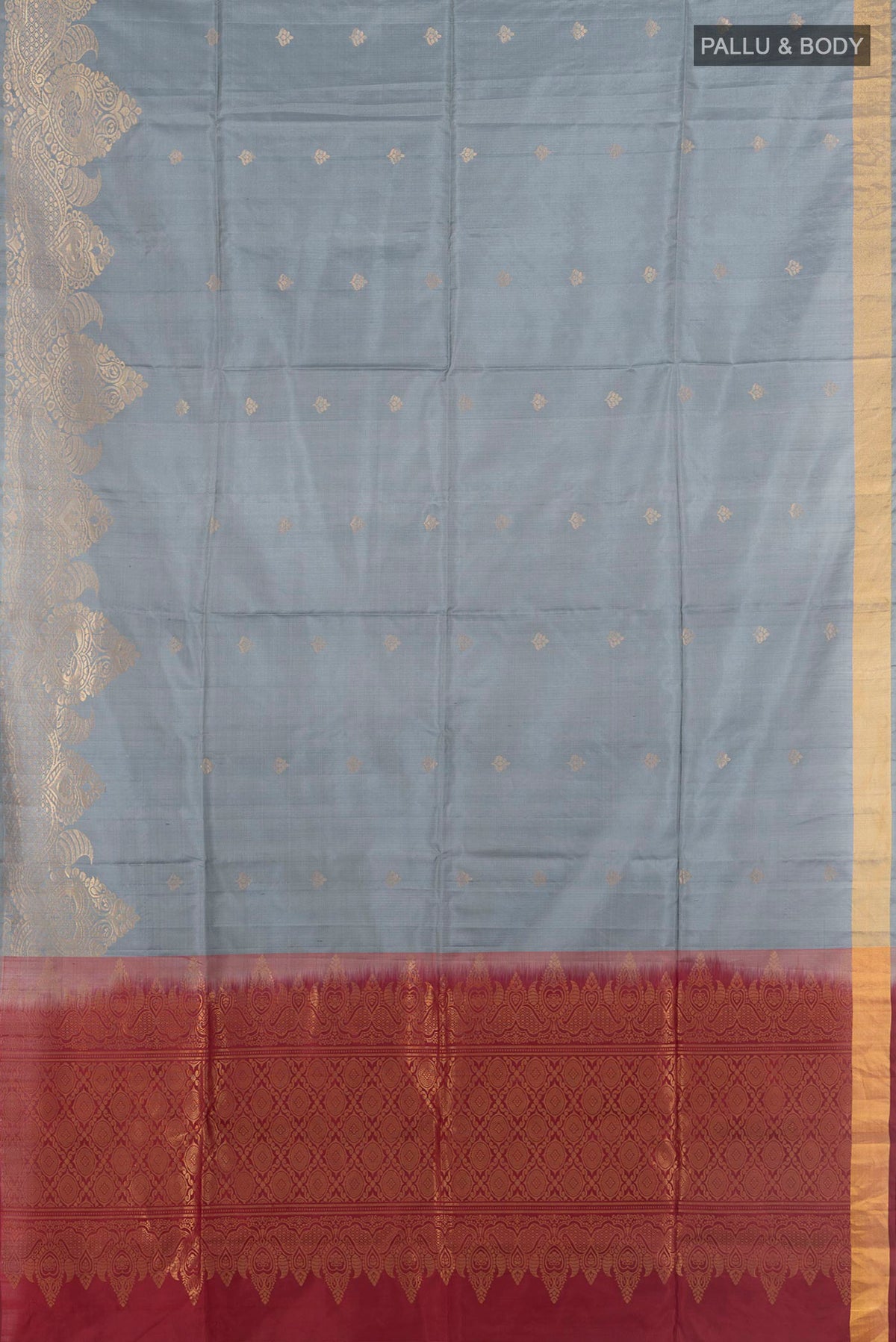 Flat view of Pure Silk Grey Soft Saree with Zari Butta on the body and Fancy Border. 