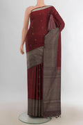 Pure Silk Rust Soft Saree with Zari Butta on the body and Fancy Border.  displayed on a mannequin