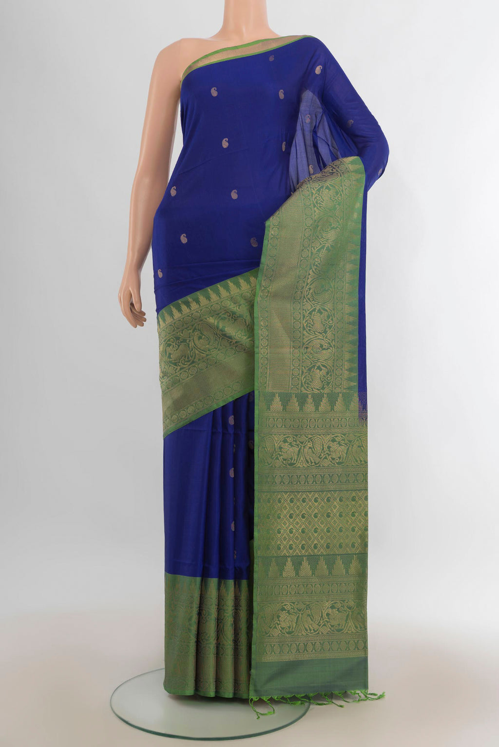 Pure Silk Royal Blue Soft Saree with Zari Butta on the body and Fancy Border.  displayed on a mannequin