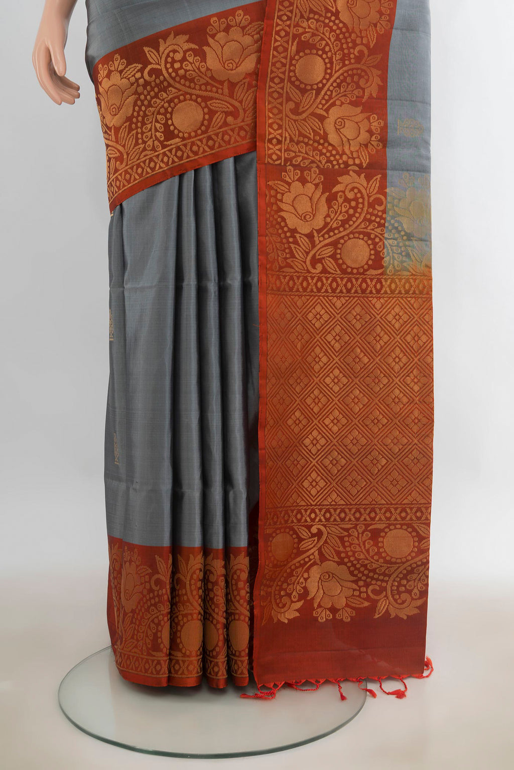 Pleats and pallu of Pure Silk Davys Grey Soft Saree with Zari Butta on the body and Fancy Border. 
