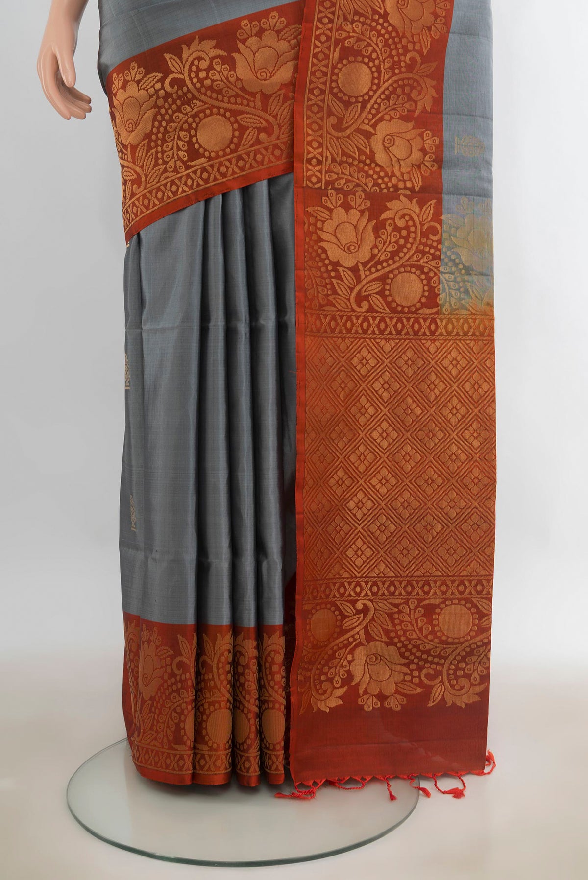 Pleats and pallu of Pure Silk Davys Grey Soft Saree with Zari Butta on the body and Fancy Border. 