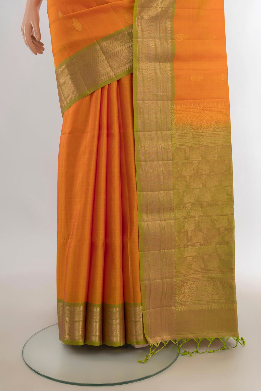Pleats and pallu of Pure Silk Yellow Soft Saree with Zari Butta on the body and Zari Border. 
