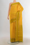 Pure Silk Mustard Soft Saree with Zari Butta on the body and Zari Border.  displayed on a mannequin