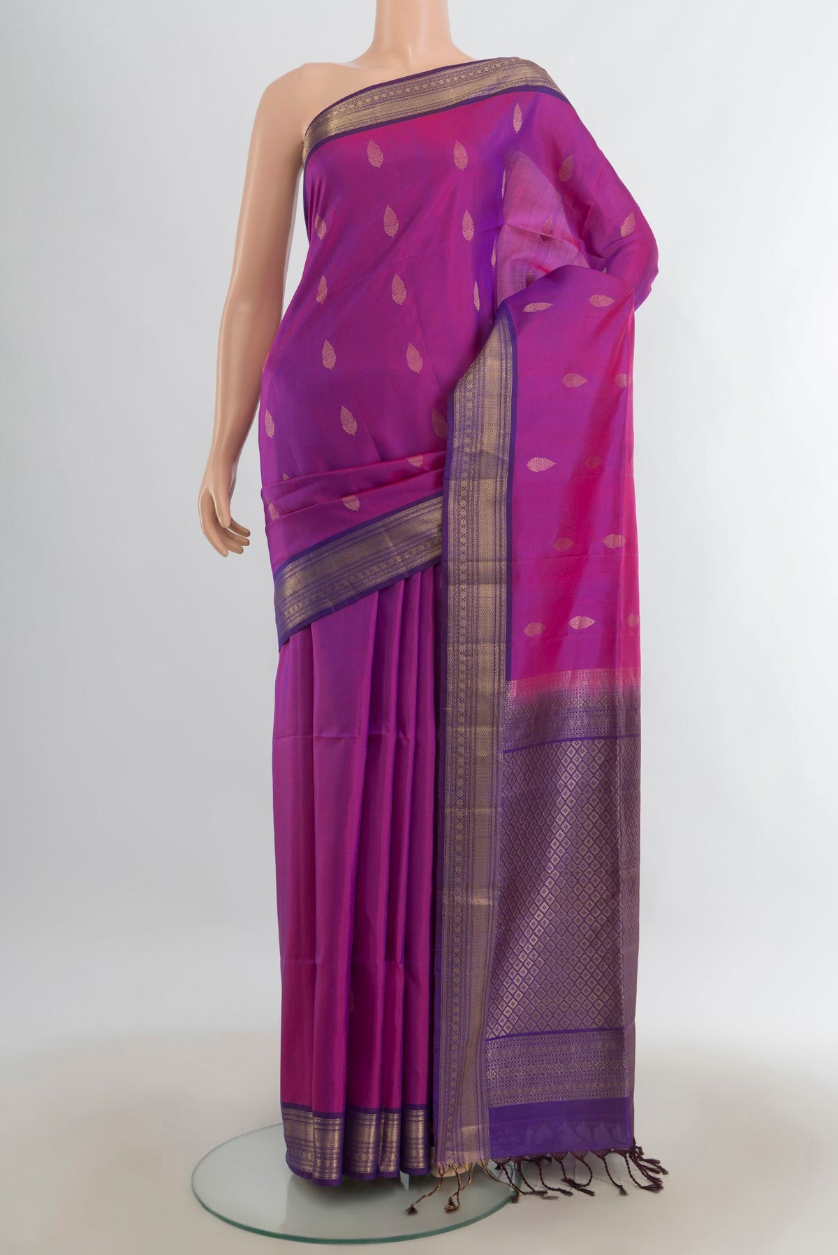 Pure Silk Purple Soft Saree with Zari Butta on the body and Silk Border.  displayed on a mannequin