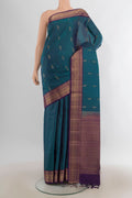 Pure Silk Peacock Blue Soft Saree with Zari Butta on the body and Zari Border.  displayed on a mannequin