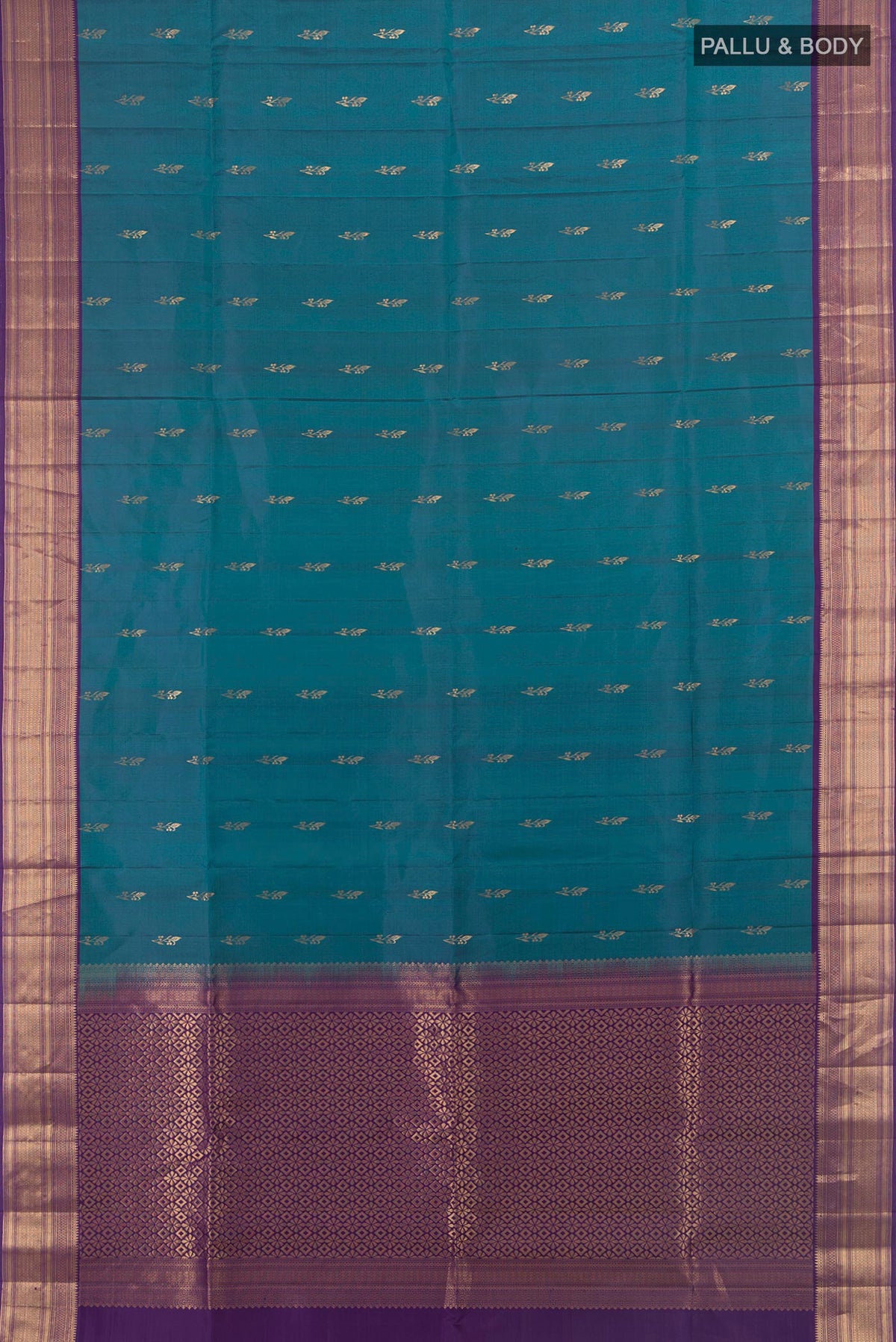 Flat view of Pure Silk Peacock Blue Soft Saree with Zari Butta on the body and Zari Border. 