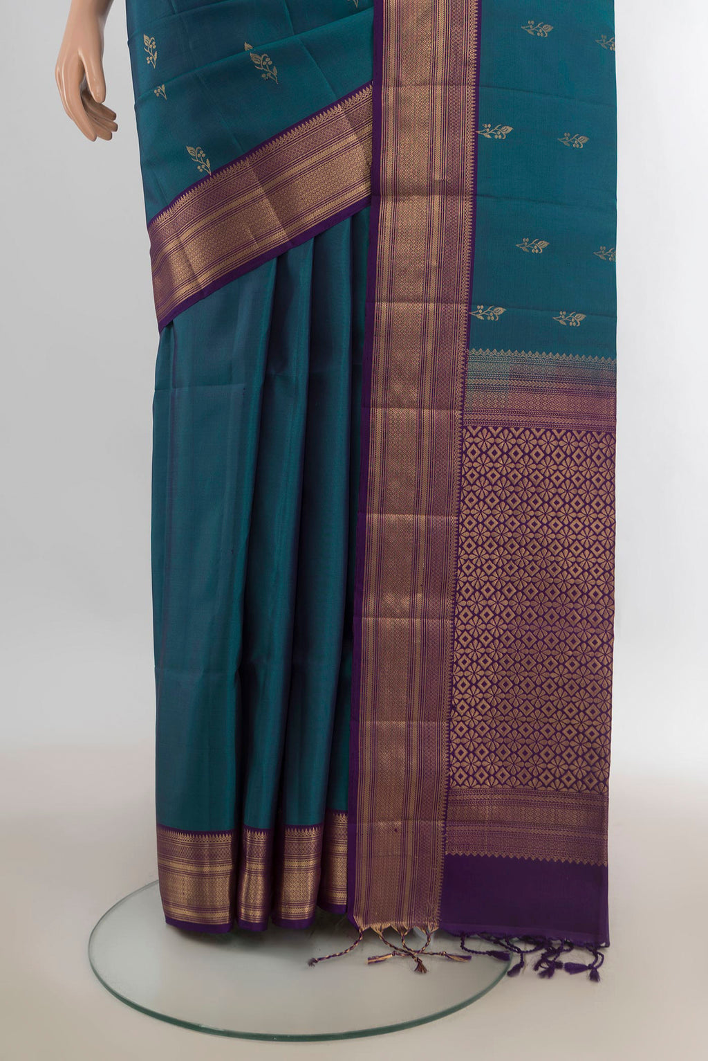 Pleats and pallu of Pure Silk Peacock Blue Soft Saree with Zari Butta on the body and Zari Border. 
