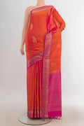 Pure Silk Brick Orange Soft Saree with Zari Butta on the body and Zari Border.  displayed on a mannequin