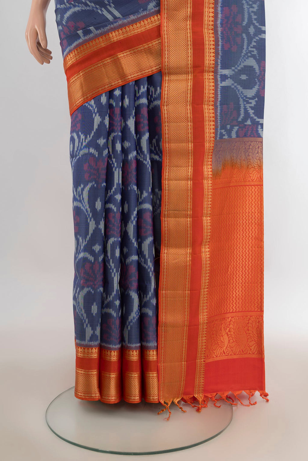 Pleats and pallu of Pure Silk Grey Soft Saree with Ikat Print on the body and Zari Border. 
