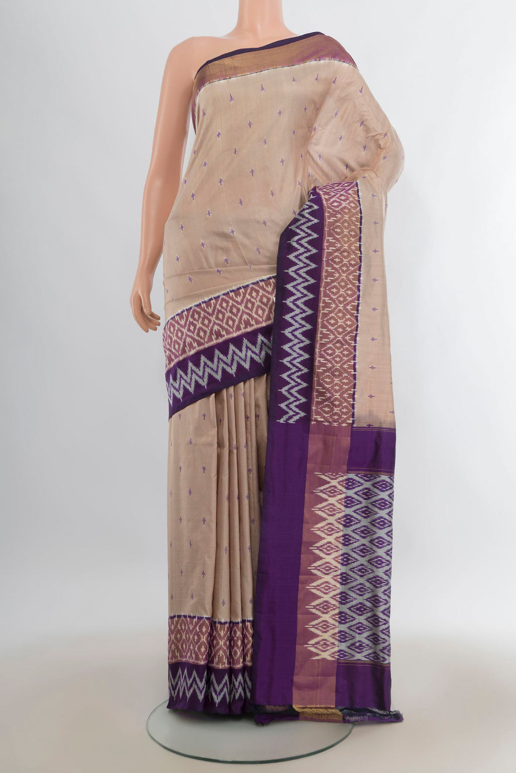 Pure Silk Beige Pochampally Saree with Pure Ikat on the body and Zari Border.  displayed on a mannequin