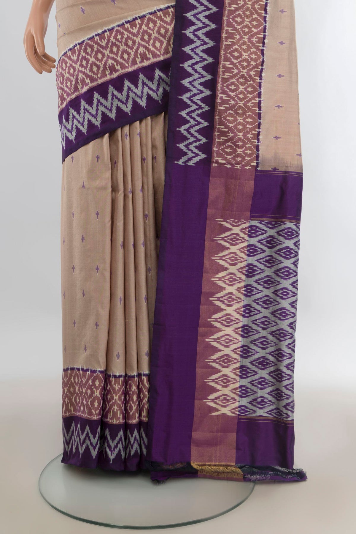 Pleats and pallu of Pure Silk Beige Pochampally Saree with Pure Ikat on the body and Zari Border. 