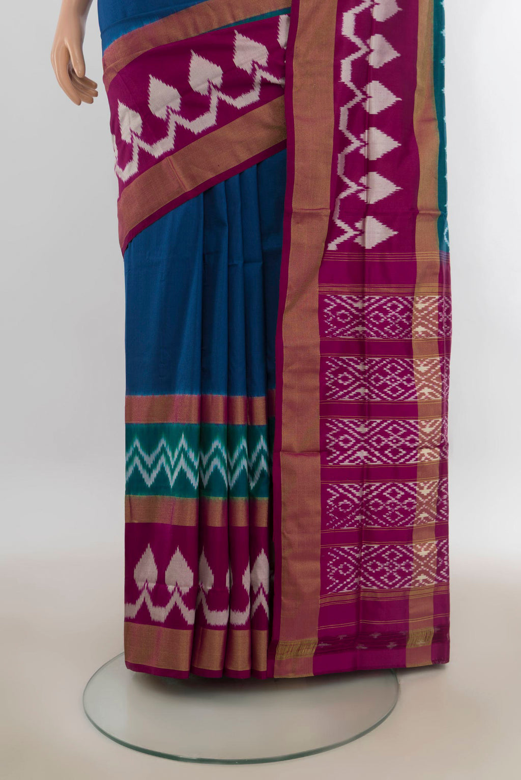 Pleats and pallu of Pure Silk Peacock Blue Pochampally Saree with Plain Body and Ikat Border. 