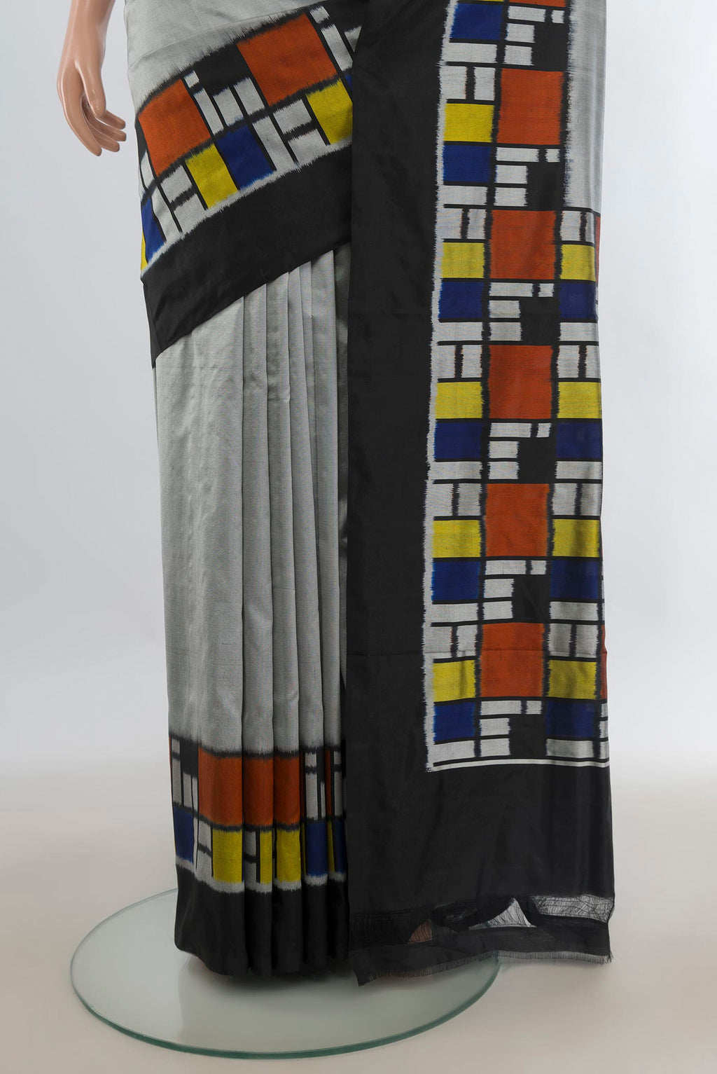 Pleats and pallu of Pure Silk Grey Pochampally Saree with Plain Body and Ikat Border. 