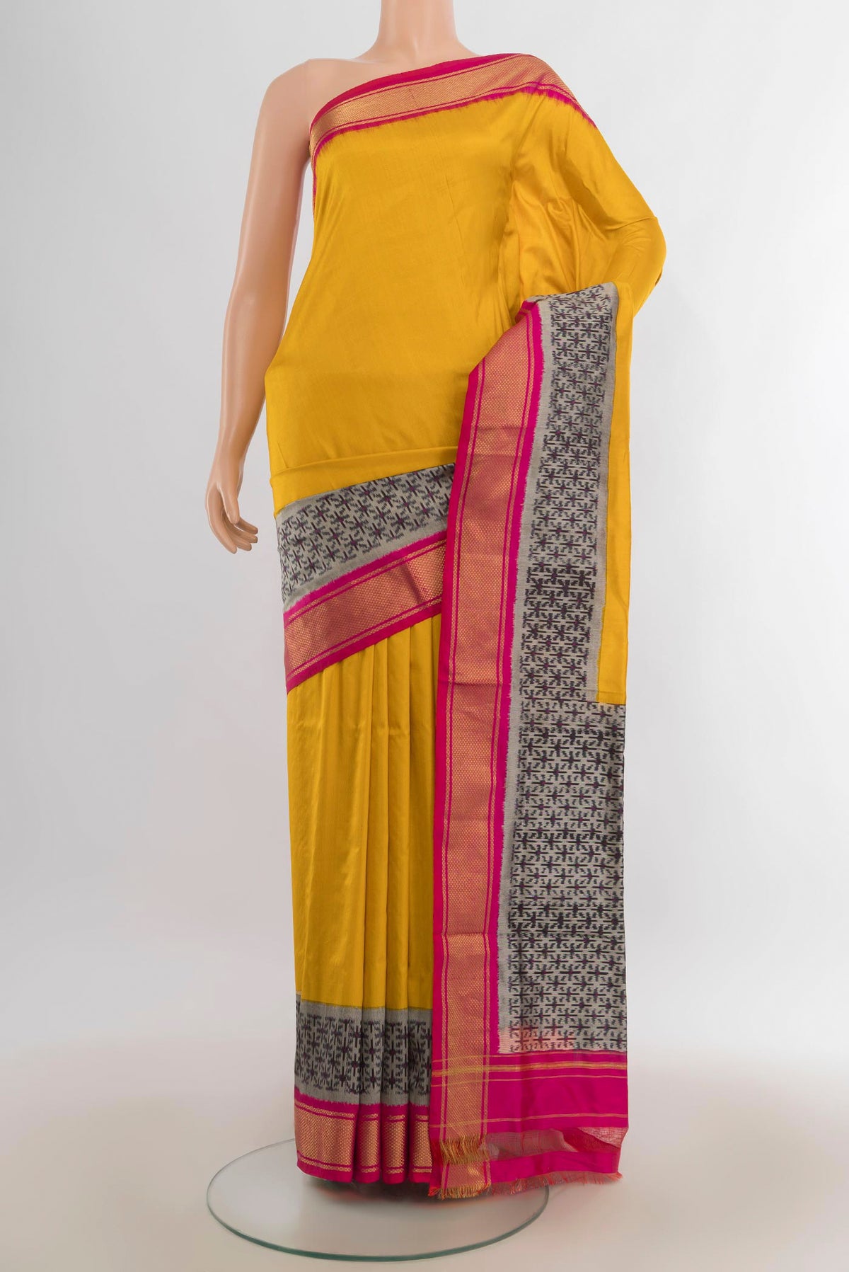 Pure Silk Mustard Pochampally Saree with Plain Body and Zari Border.  displayed on a mannequin