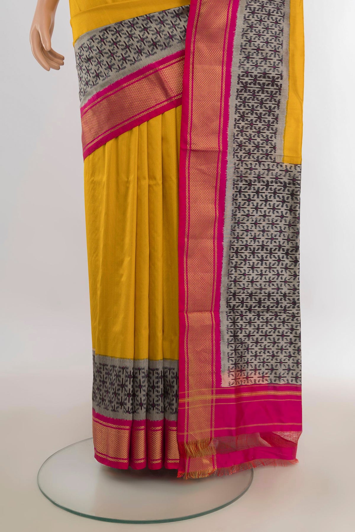 Pleats and pallu of Pure Silk Mustard Pochampally Saree with Plain Body and Zari Border. 