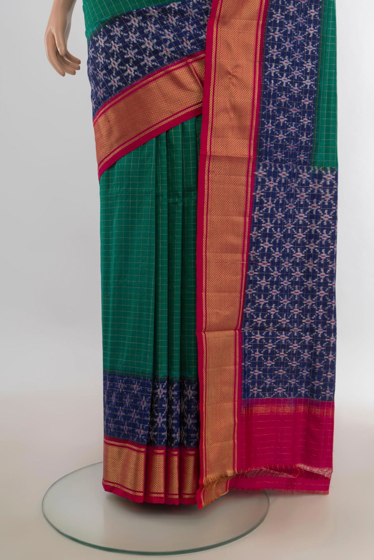 Pleats and pallu of Pure Silk Sea Green Pochampally Saree with Checked design on the body and Zari Border. 