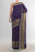 Pure Silk Navy Blue Pochampally Saree with Pure Ikat on the body and Zari Border.  displayed on a mannequin