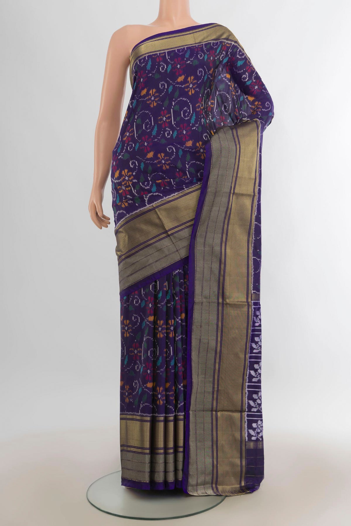 Pure Silk Navy Blue Pochampally Saree with Pure Ikat on the body and Zari Border.  displayed on a mannequin
