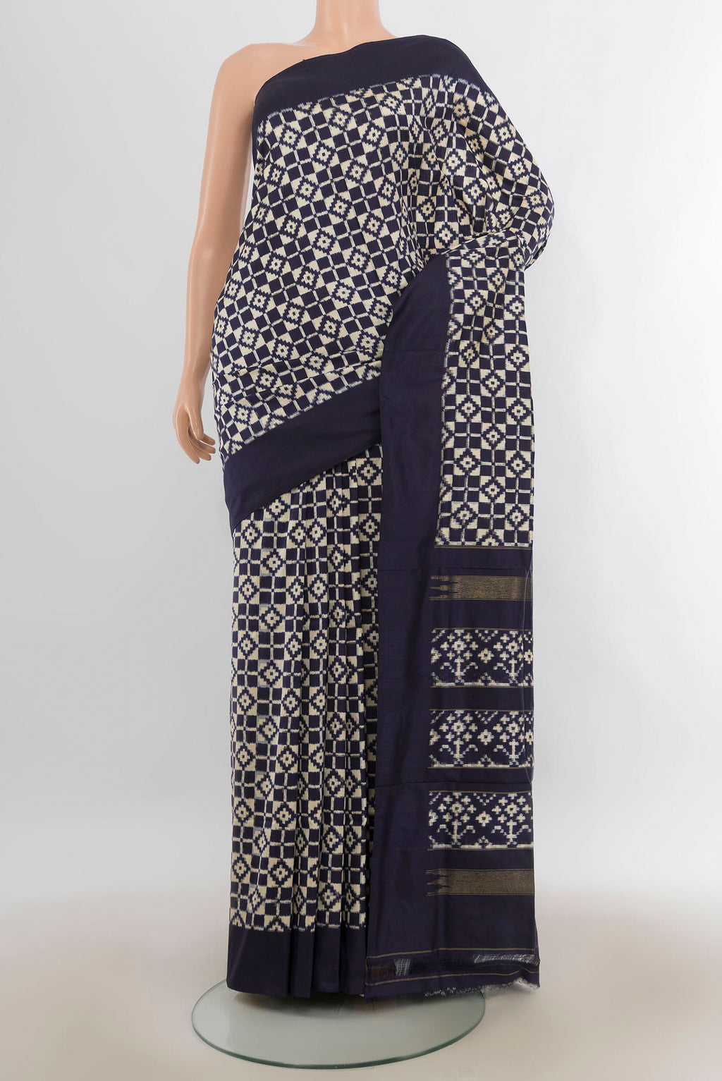 Pure Silk Cream Pochampally Saree with Pure Ikat on the body and Plain Border.  displayed on a mannequin
