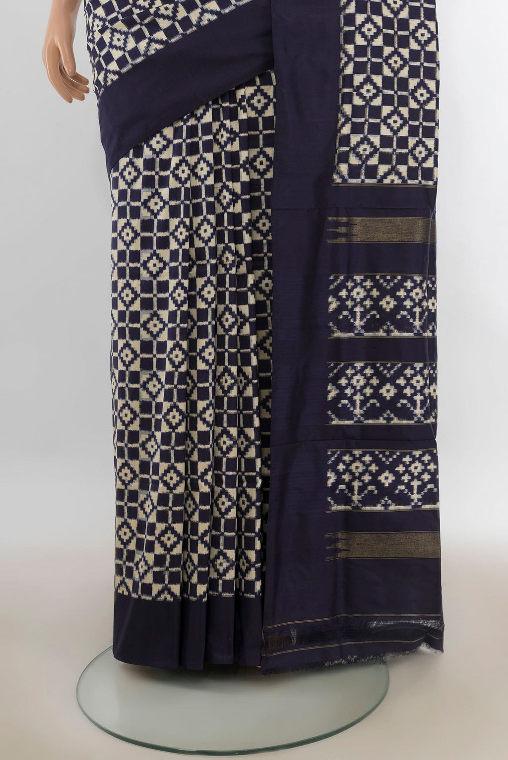 Pleats and pallu of Pure Silk Cream Pochampally Saree with Pure Ikat on the body and Plain Border. 
