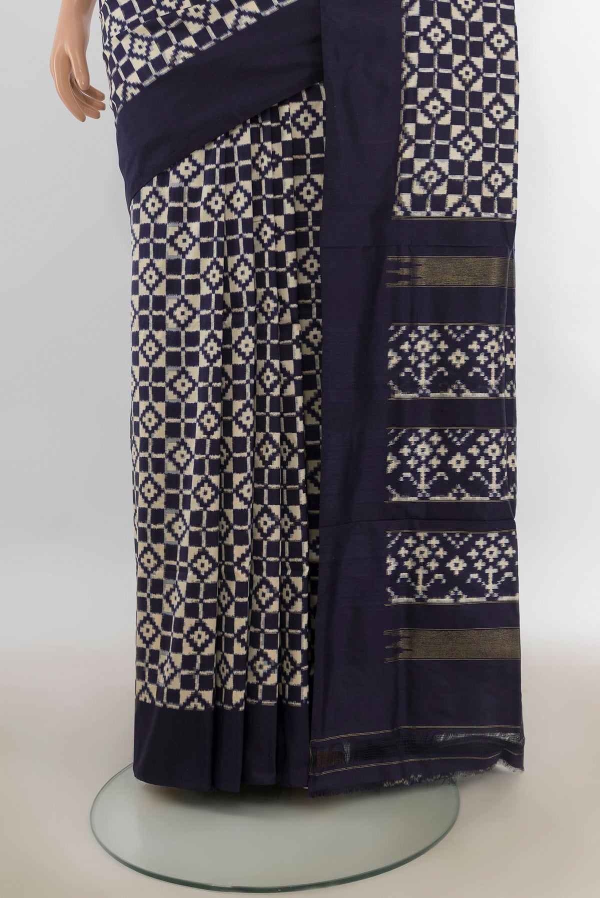 Pleats and pallu of Pure Silk Cream Pochampally Saree with Pure Ikat on the body and Plain Border. 