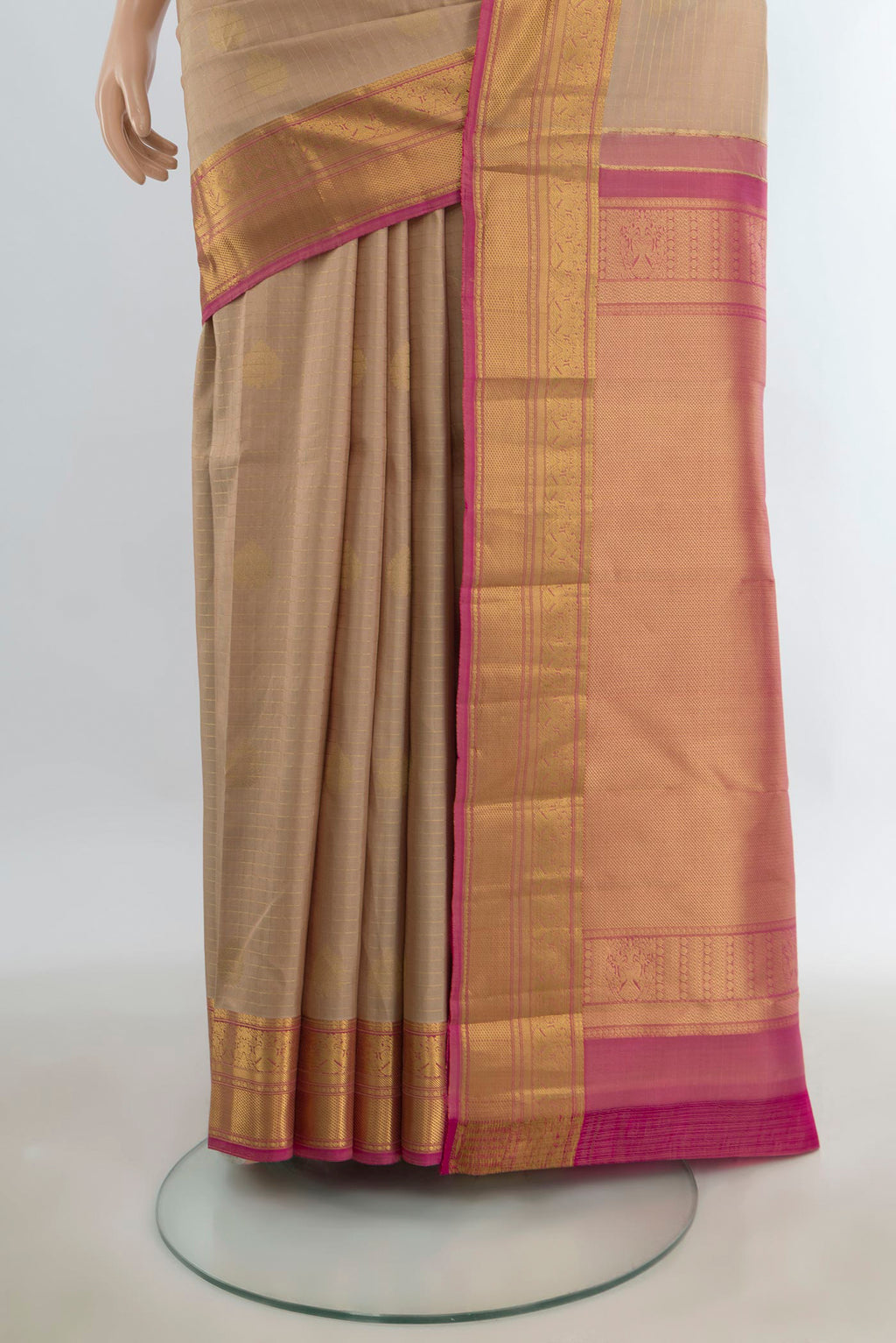 Pleats and pallu of Pure Silk Sandal Kanjivaram Saree with Zari Butta on the body and Silk Border. 