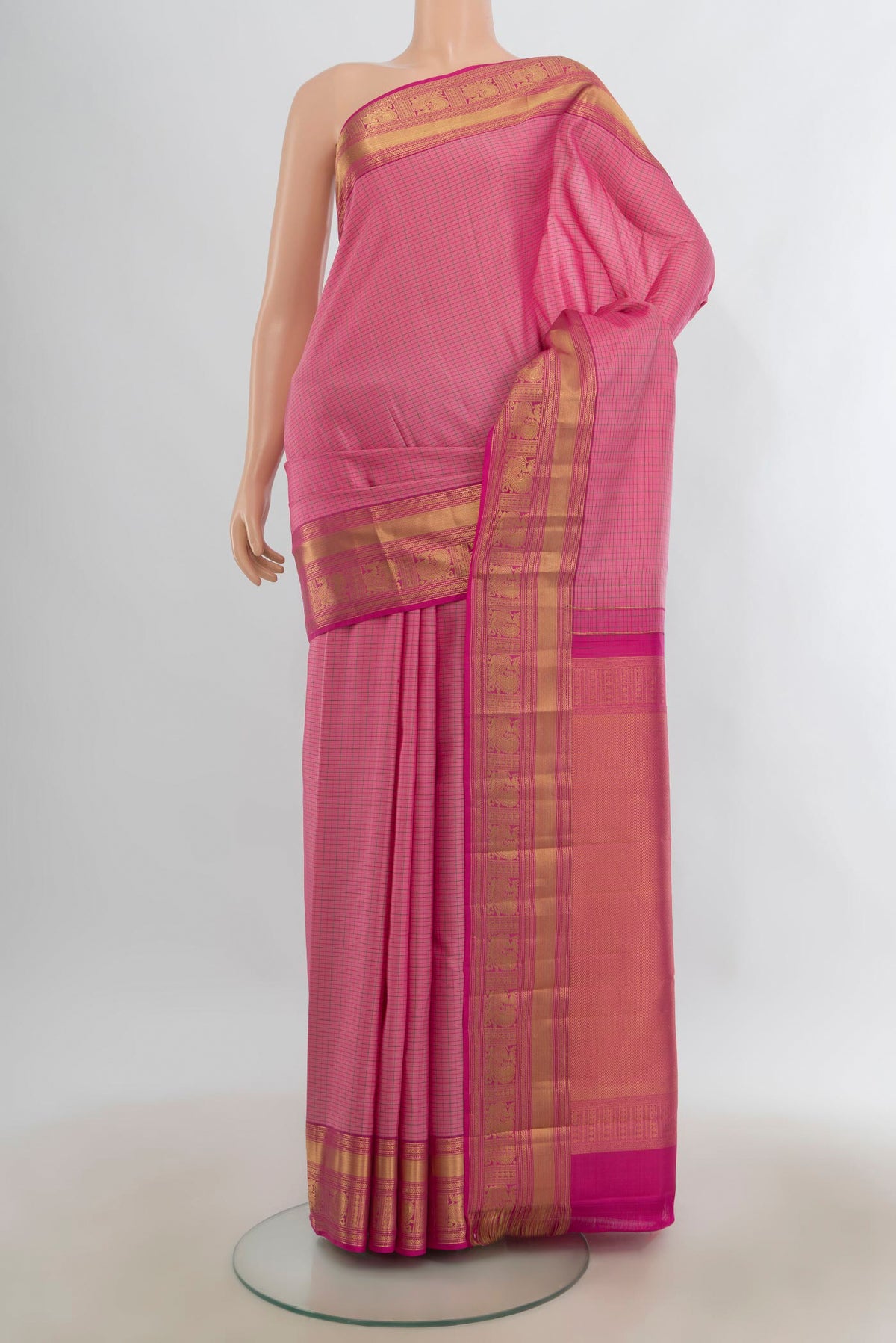 Pure Silk Rose pink Kanchipuram Saree with Checked design on the body and Zari Border.  displayed on a mannequin