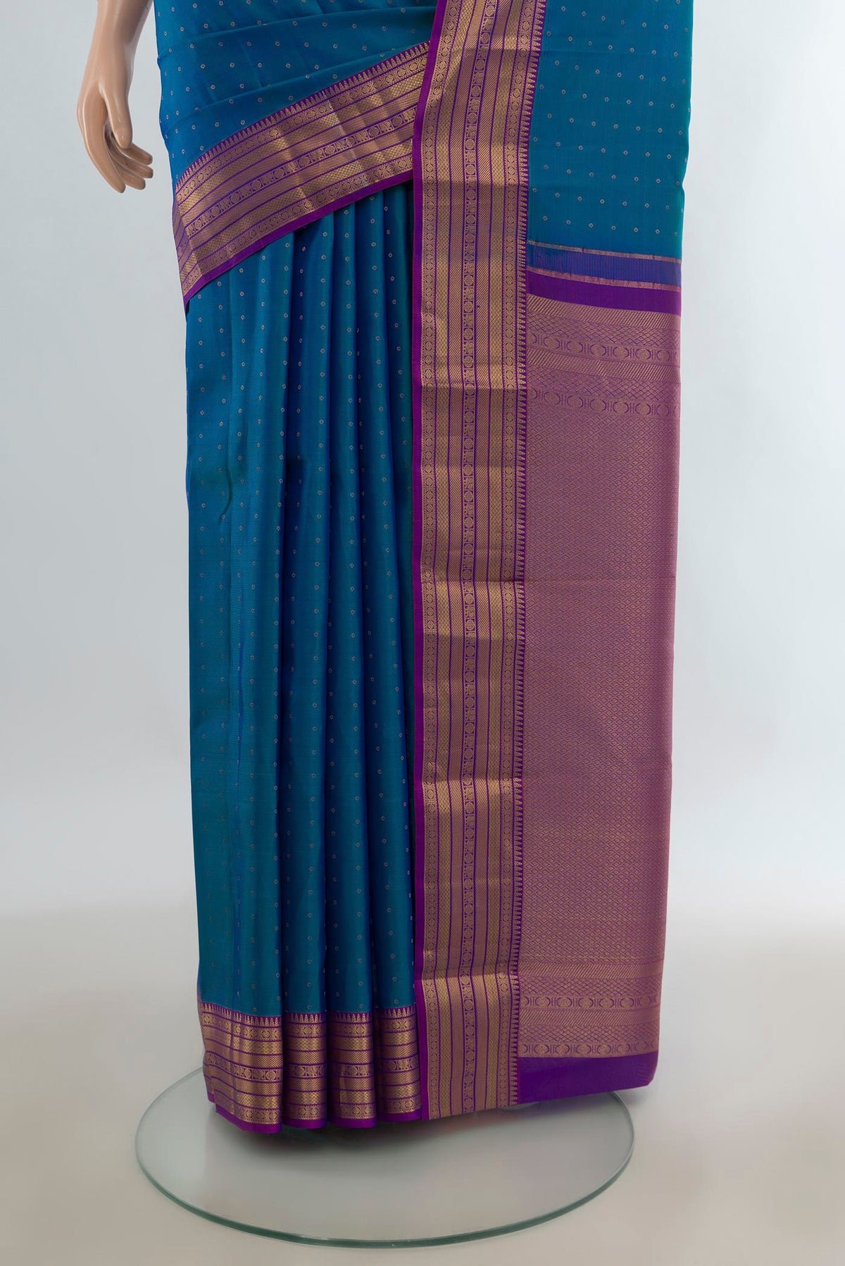 Pleats and pallu of Pure Silk Peacock Blue Kanchipuram Saree with Zari Butta on the body and Zari Border. 