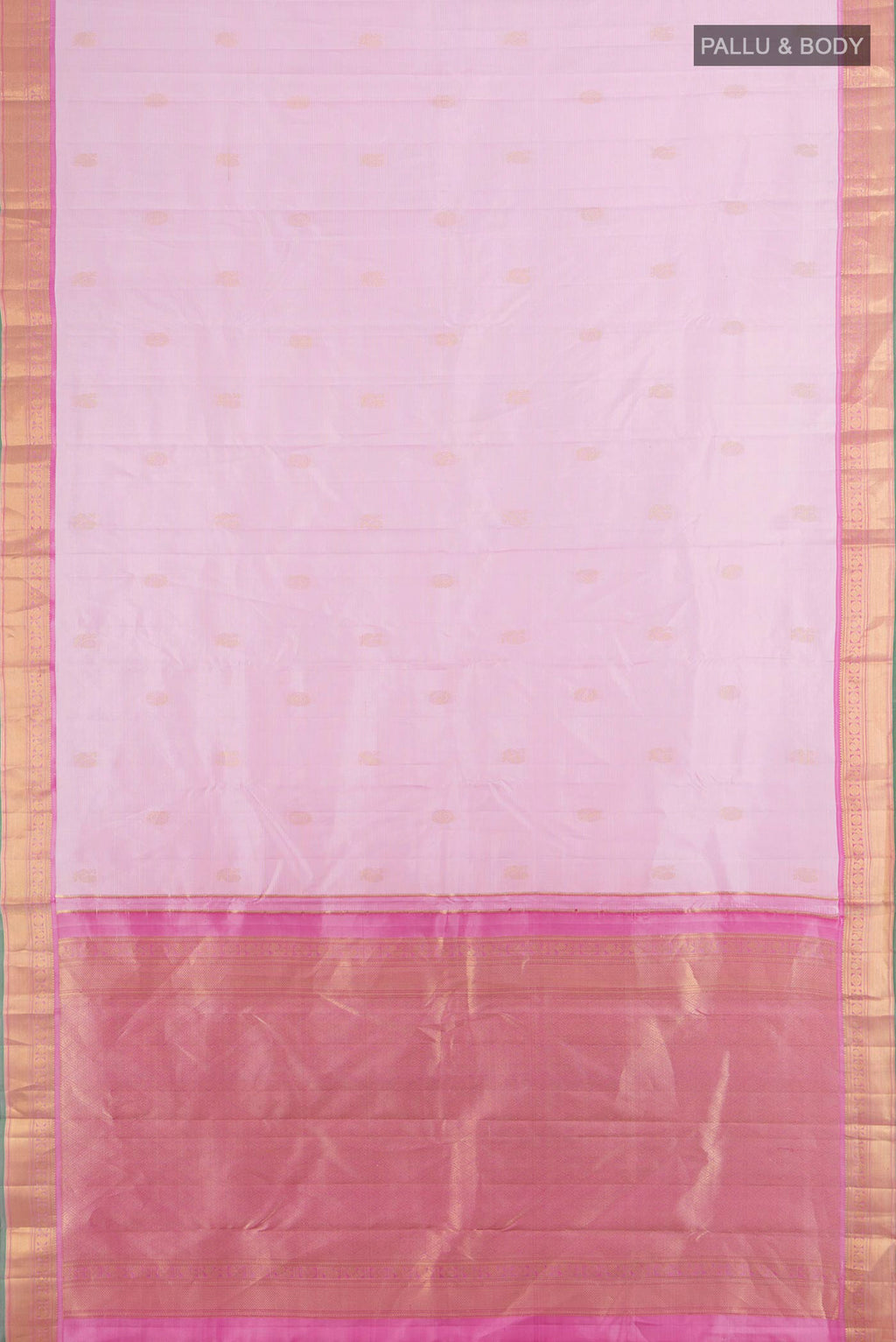 Flat view of Pure Silk Rose Gold Kanchipuram Saree with Zari Butta on the body and Silk Border. 