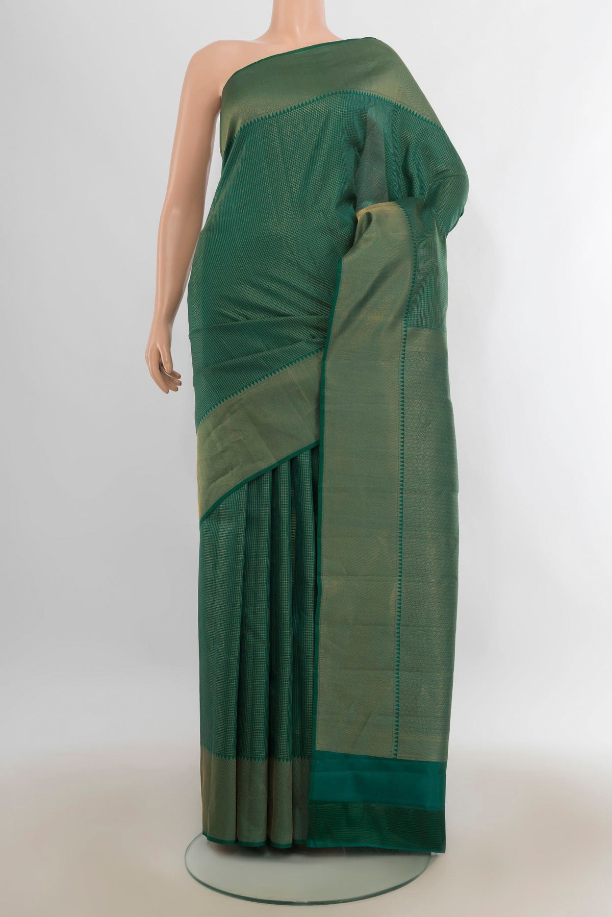 Pure Silk Green Kanchipuram Saree with Checked design on the body and Zari Border.  displayed on a mannequin