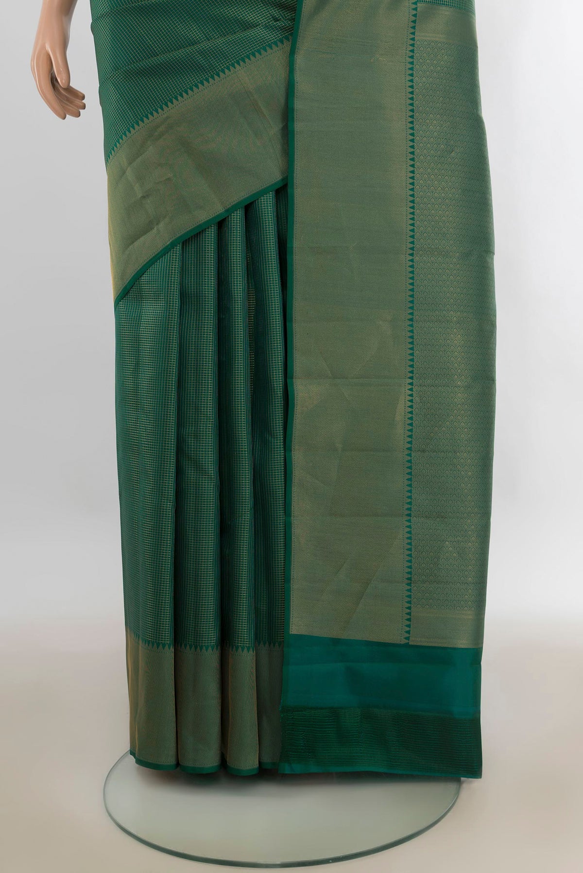 Pleats and pallu of Pure Silk Green Kanchipuram Saree with Checked design on the body and Zari Border. 