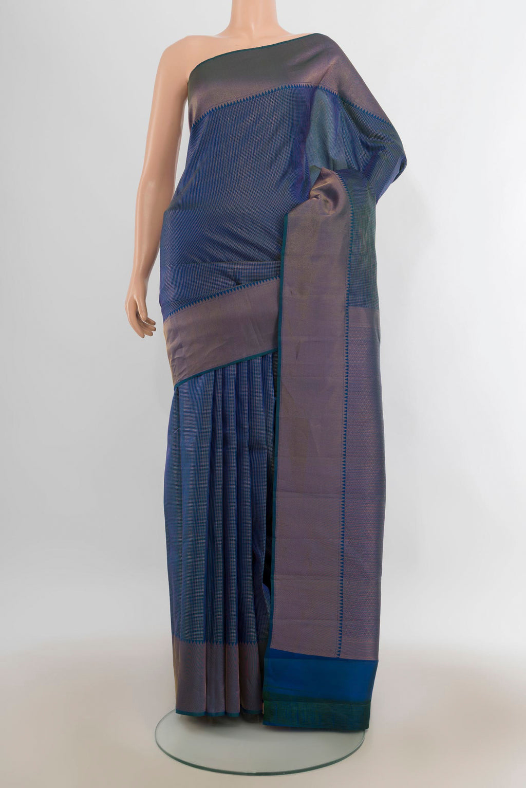 Pure Silk Peacock Blue Kanchipuram Saree with Checked design on the body and Zari Border.  displayed on a mannequin