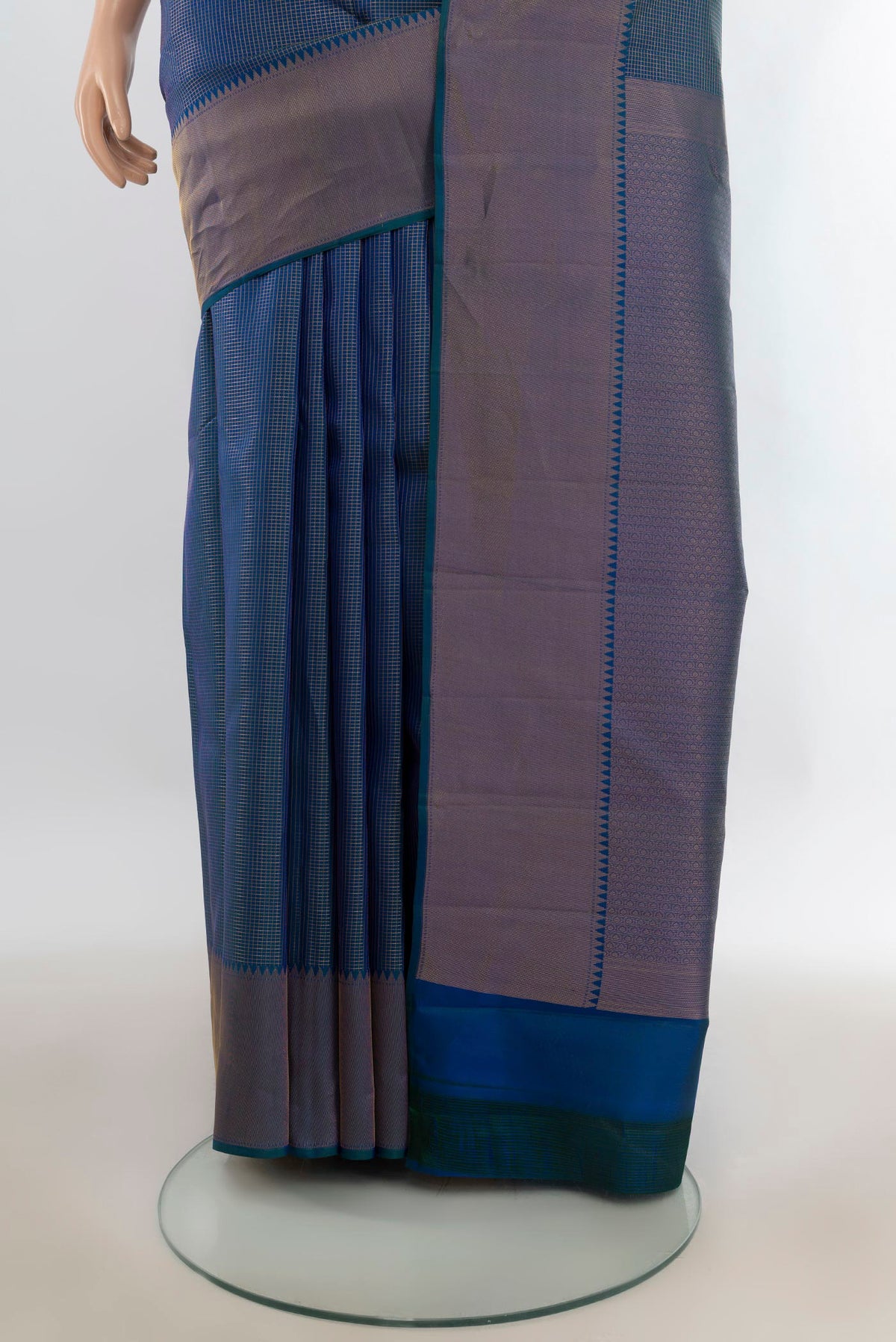 Pleats and pallu of Pure Silk Peacock Blue Kanchipuram Saree with Checked design on the body and Zari Border. 
