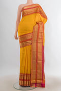 Pure Silk Yellow Kanjivaram Saree with Zari Butta on the body and Zari Border.  displayed on a mannequin