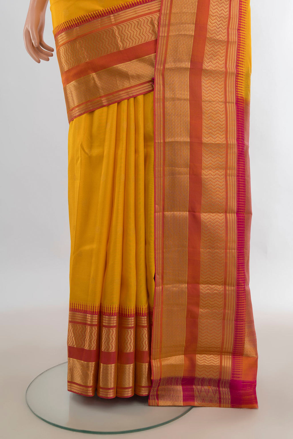 Pleats and pallu of Pure Silk Yellow Kanjivaram Saree with Zari Butta on the body and Zari Border. 