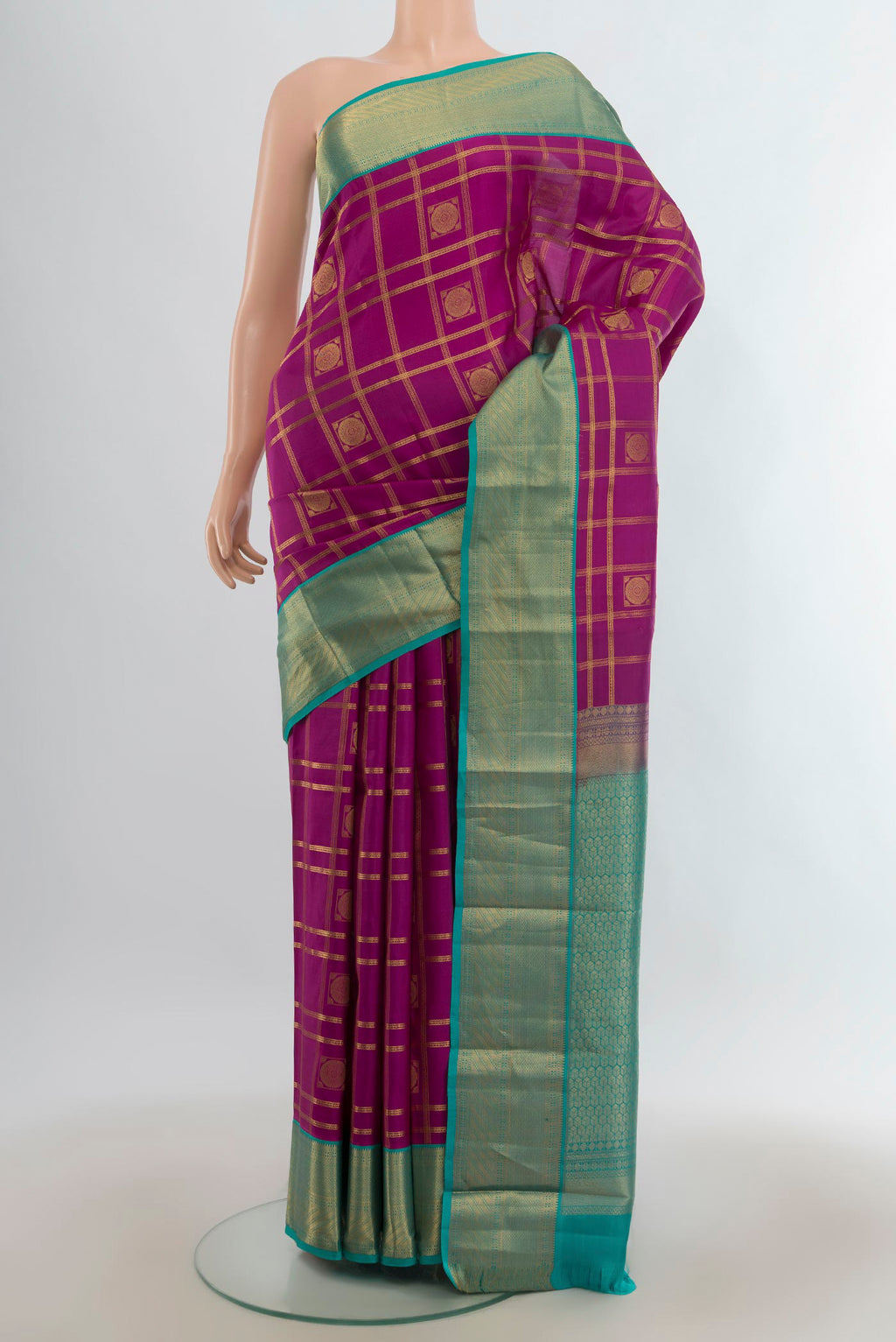Pure Silk Magenta Kanchipuram Saree with Checked design on the body and Zari Border.  displayed on a mannequin