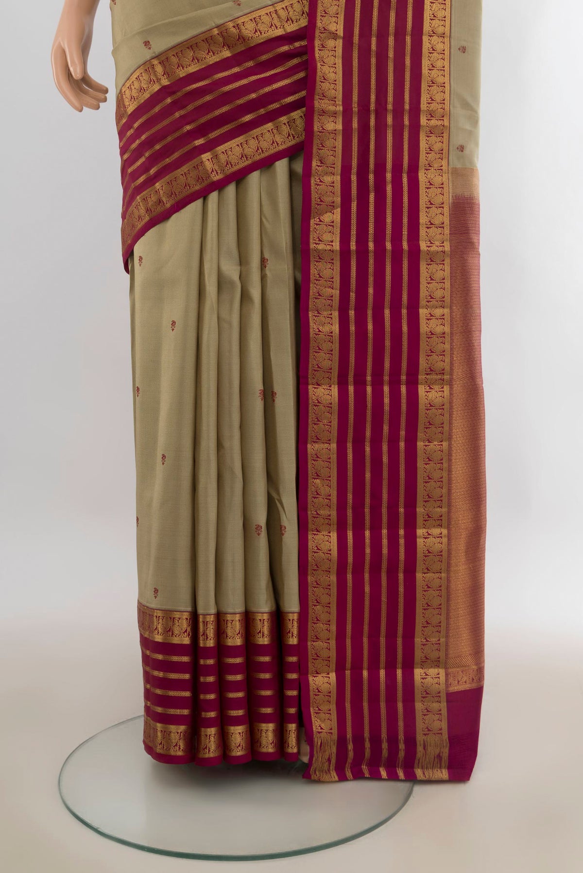 Pleats and pallu of Pure Silk Dark Beige Kanjivaram Saree with Thread Butta on the body and Zari Border. 