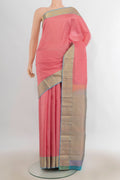 Pure Silk Peach Kanchipuram Saree with Checked design on the body and Zari Border.  displayed on a mannequin