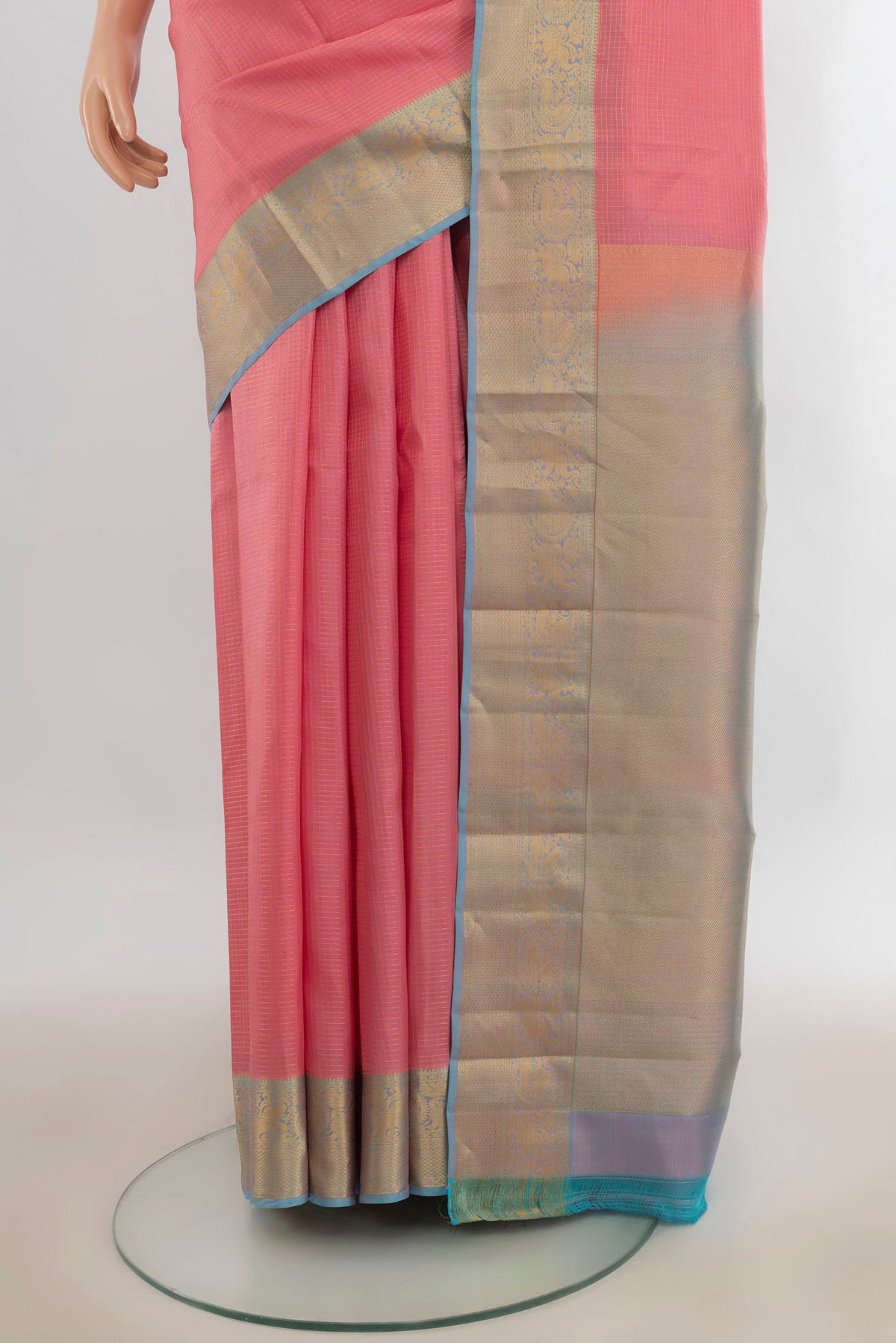 Pleats and pallu of Pure Silk Peach Kanchipuram Saree with Checked design on the body and Zari Border. 