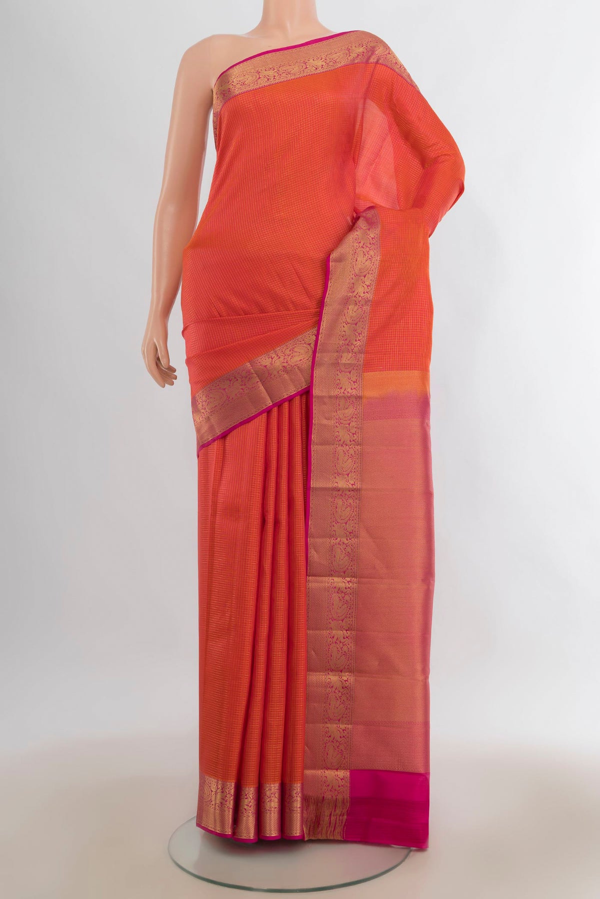 Pure Silk Orange Kanchipuram Saree with Checked design on the body and Zari Border.  displayed on a mannequin