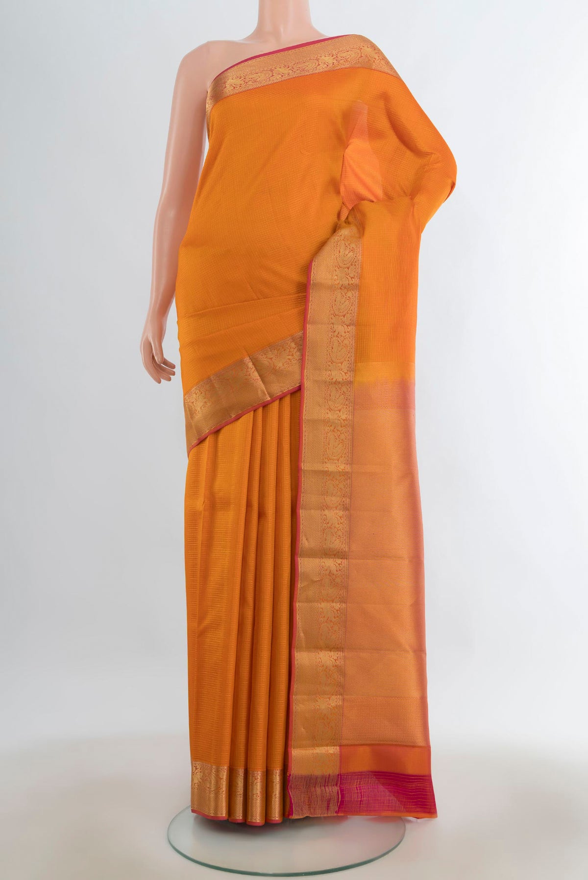 Pure Silk Rust Kanchipuram Saree with Checked design on the body and Silk Border.  displayed on a mannequin