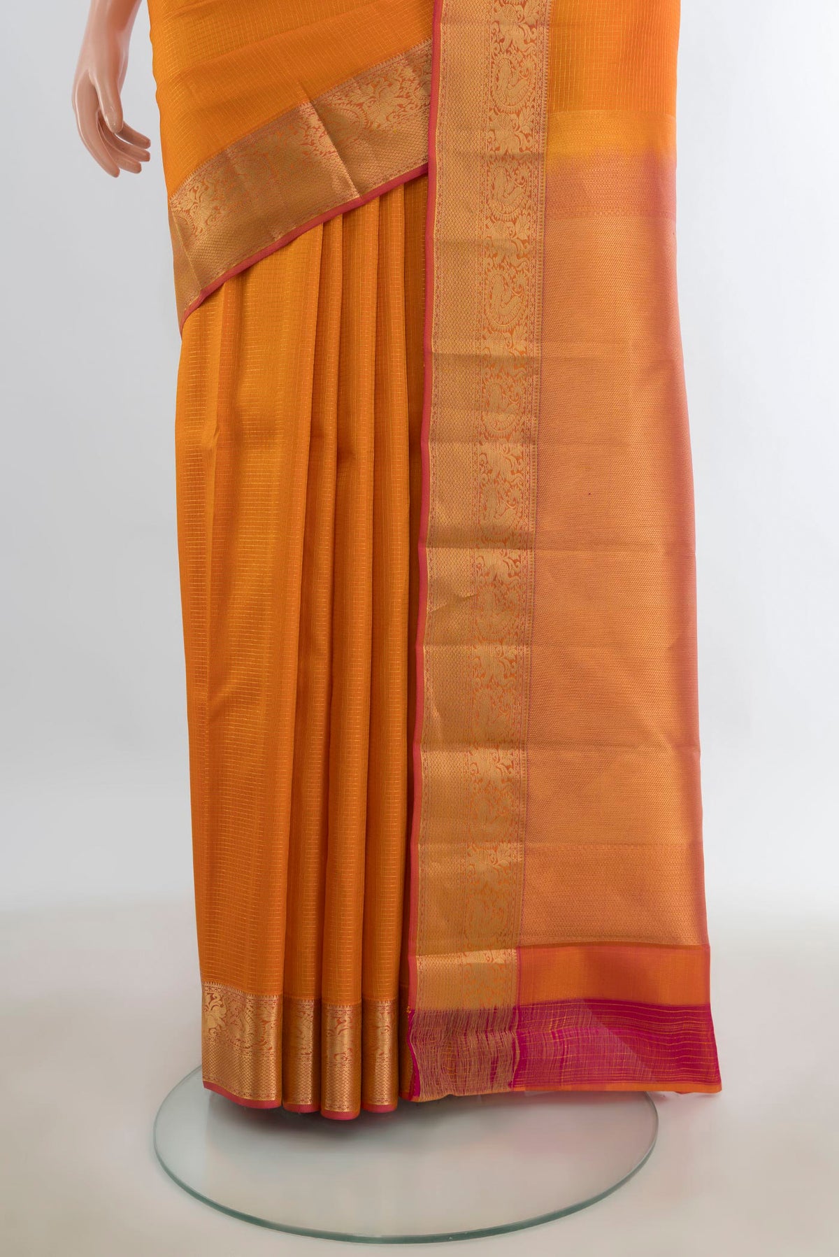 Pleats and pallu of Pure Silk Rust Kanchipuram Saree with Checked design on the body and Silk Border. 