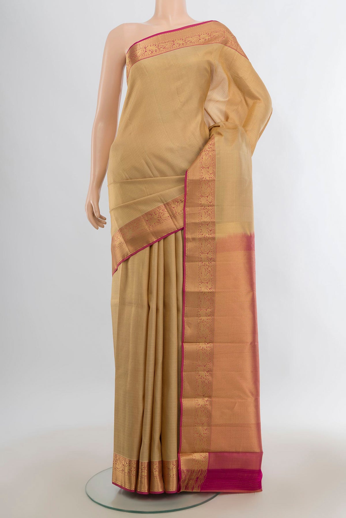 Pure Silk Sandal Kanchipuram Saree with Zari Butta on the body and Zari Border.  displayed on a mannequin