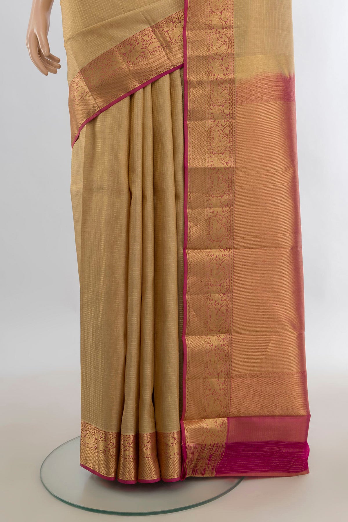 Pleats and pallu of Pure Silk Sandal Kanchipuram Saree with Zari Butta on the body and Zari Border. 