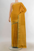 Pure Silk Mustard Kanchipuram Saree with Checked design on the body and Zari Border.  displayed on a mannequin