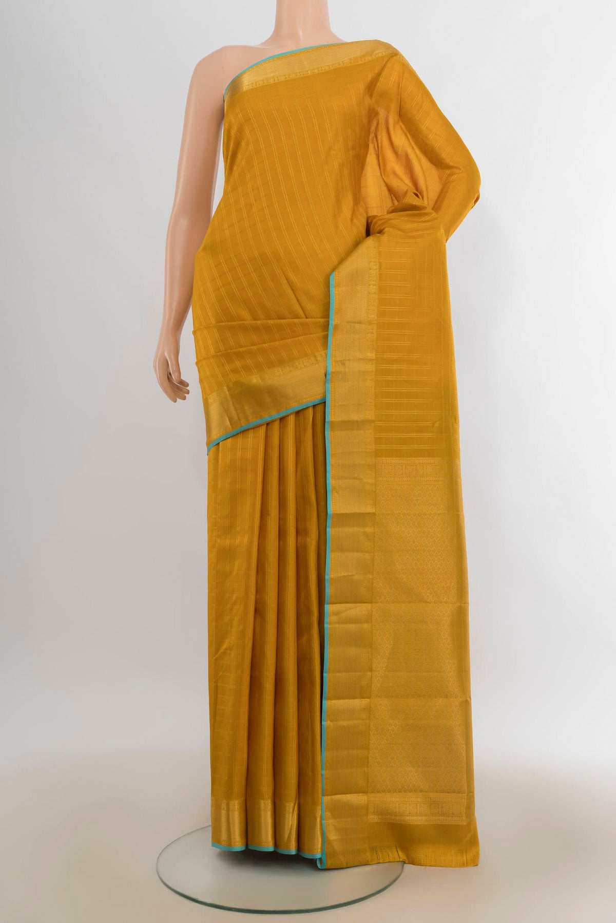 Pure Silk Mustard Kanchipuram Saree with Checked design on the body and Zari Border.  displayed on a mannequin