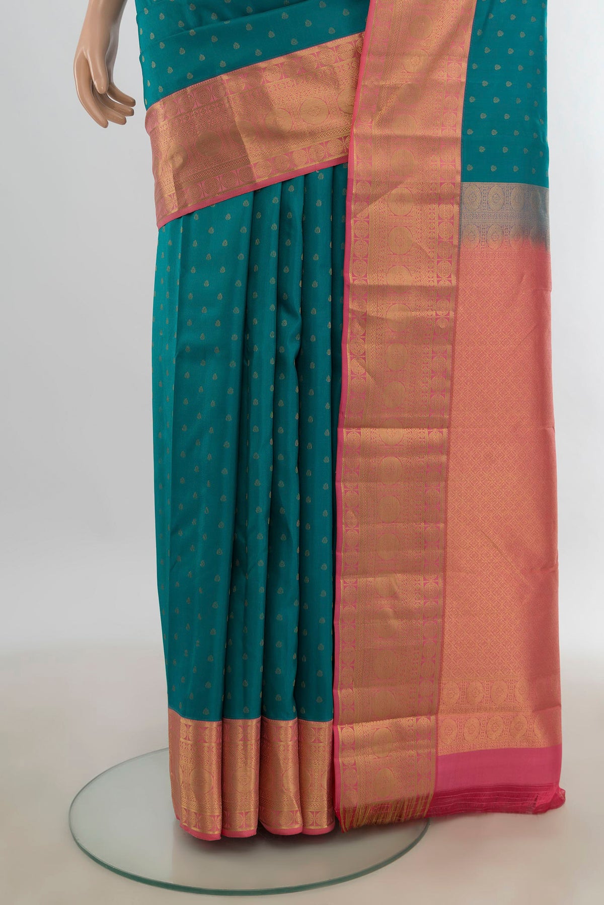 Pleats and pallu of Pure Silk Peacock Blue Kanjivaram Saree with Zari Butta on the body and Silk Border. 