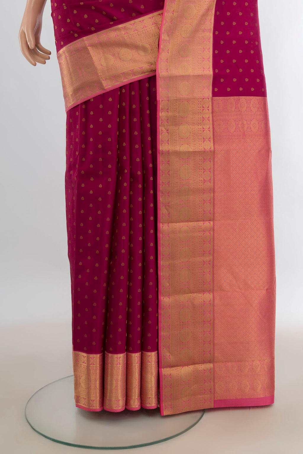 Pleats and pallu of Pure Silk Maroon Kanjivaram Saree with Zari Butta on the body and Zari Border. 