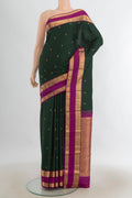 Pure Silk Sea Green Kanjivaram Saree with Zari Butta on the body and Silk Border.  displayed on a mannequin