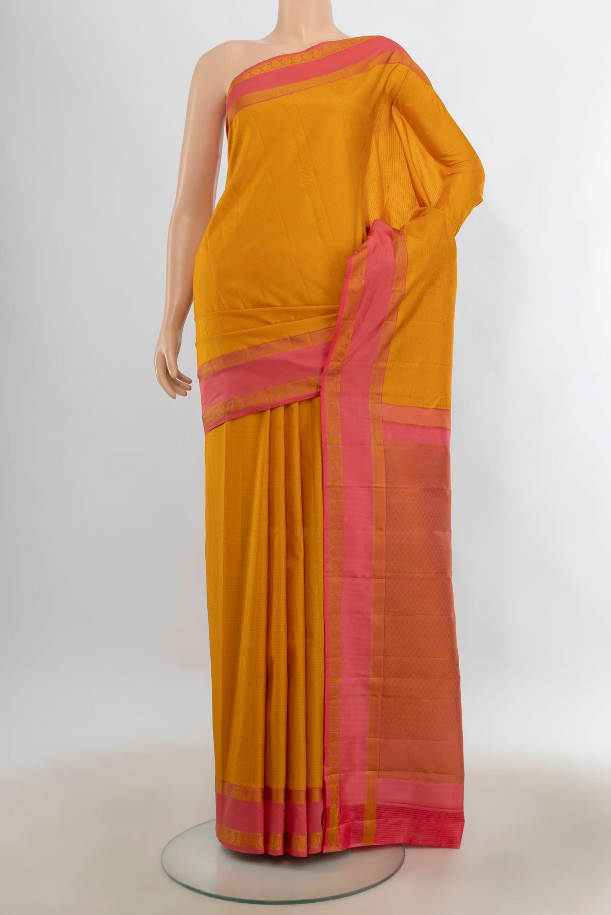 Pure Silk Mustard Kanjivaram Saree with Checked design on the body and Thread Border.  displayed on a mannequin